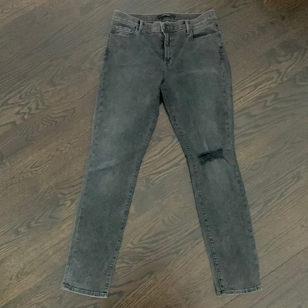 J brand black wash skinny jeans size 31 color Howl rip in one knee